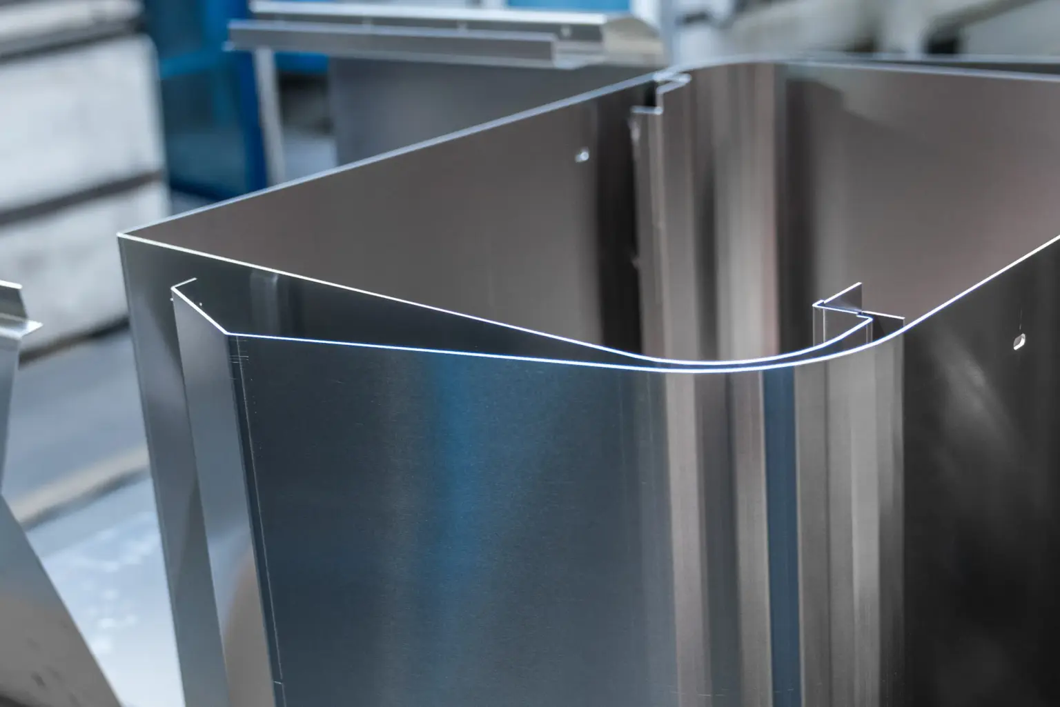 Sheet metal being folded and formed in a workshop